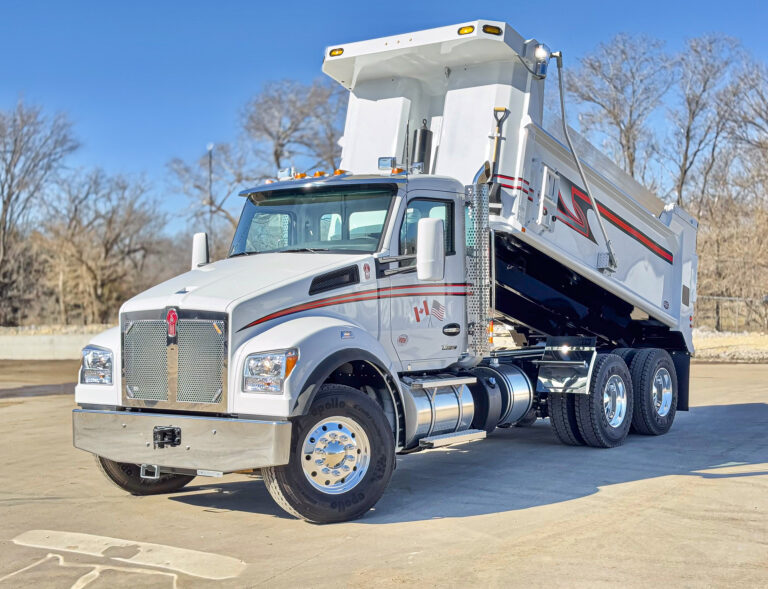 Commercial dump truck featuring bold striping, built by Master Tech Truck & Equipment