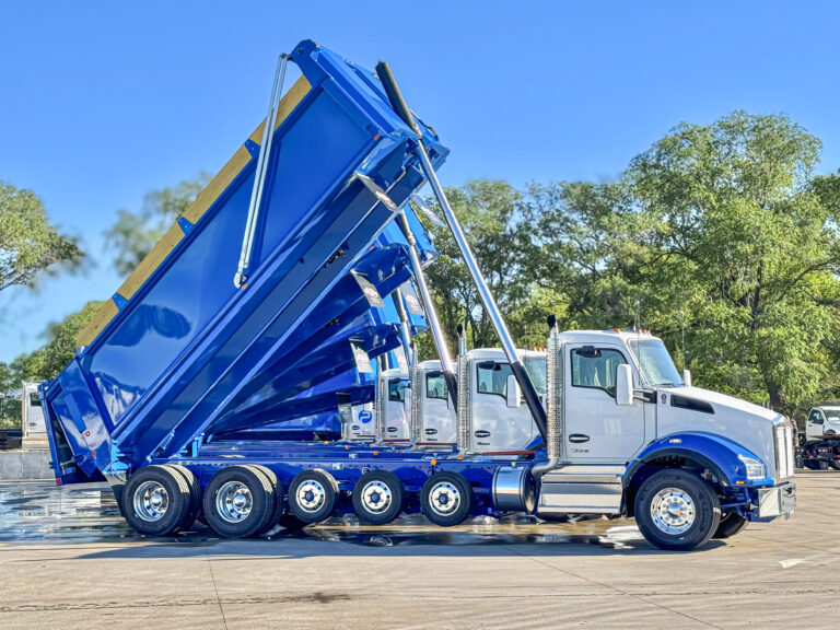 Pearson Construction Dump truck Beds extended to varying heights.