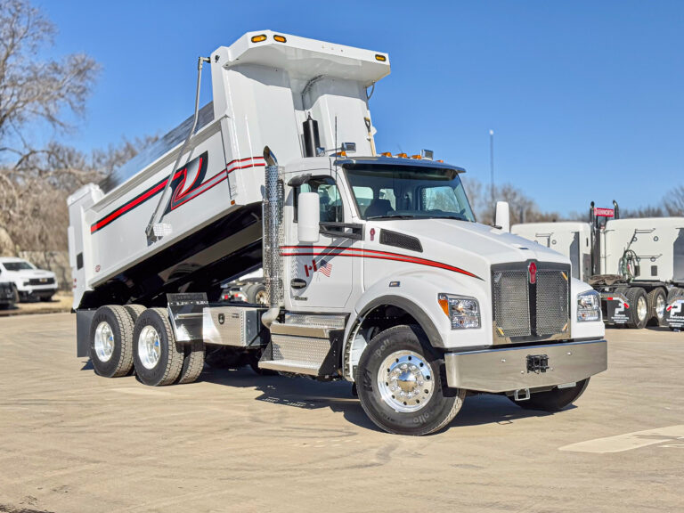 Master?Tech’s Wichita team delivered this white dump truck with red & black accent stripes, designed for contractor fleets.
